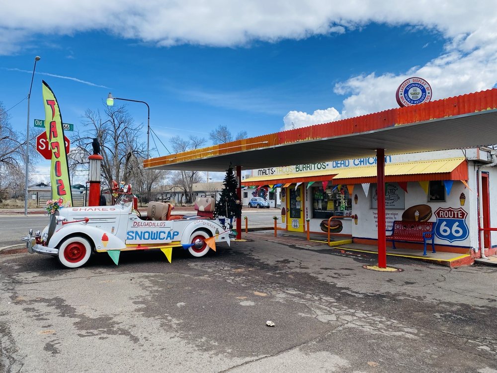 The hand-chopped 1936 Chevrolet hot rod parked outside Delgadillo's Snow Cap Drive-In